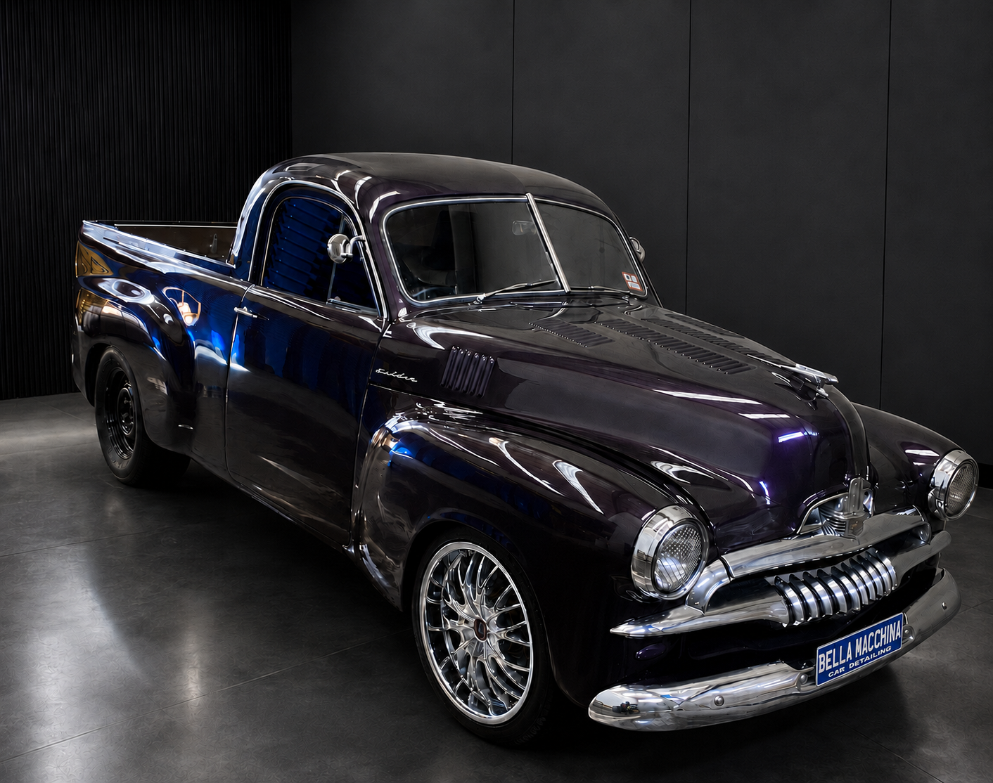 Purple classic car with blue Bella Macchina Car Detailing custom plate